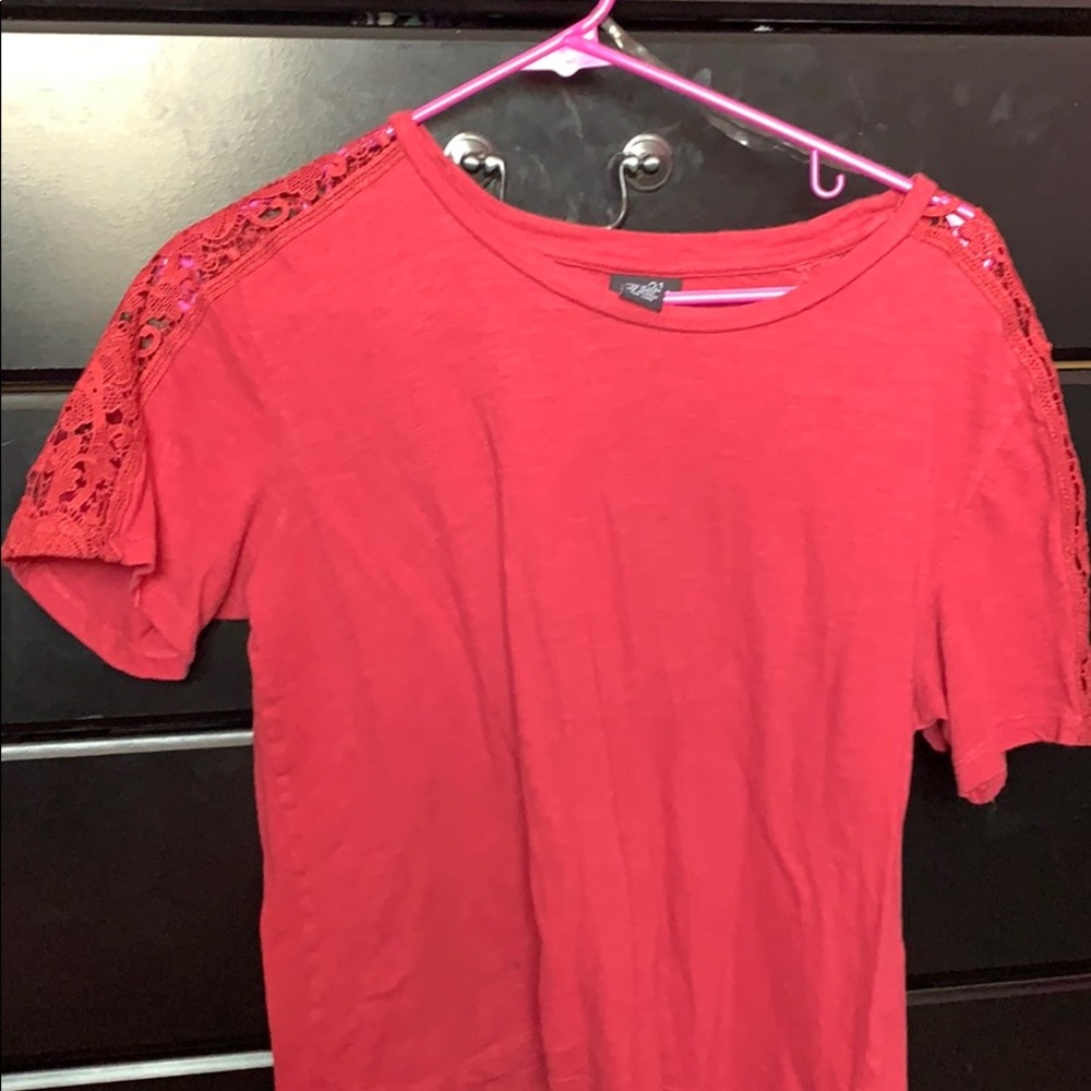 pink crop top with open floral print on shoulder